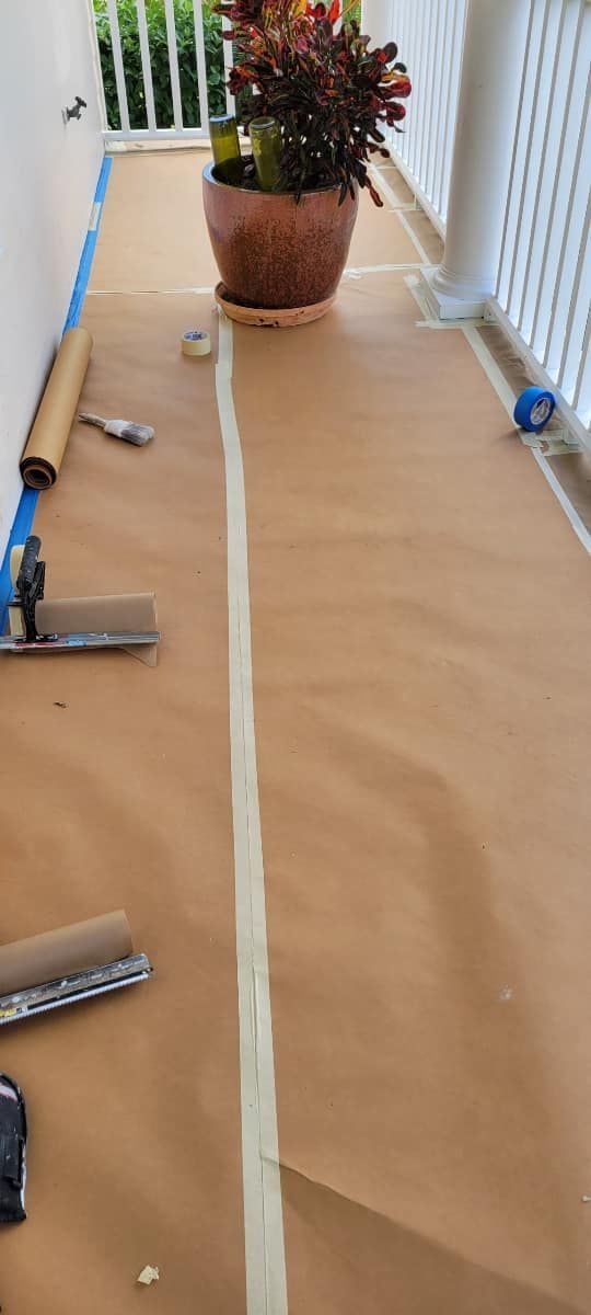 A potted plant is sitting on top of a piece of brown paper.