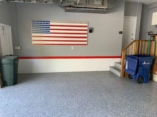 A garage with a large american flag on the wall.