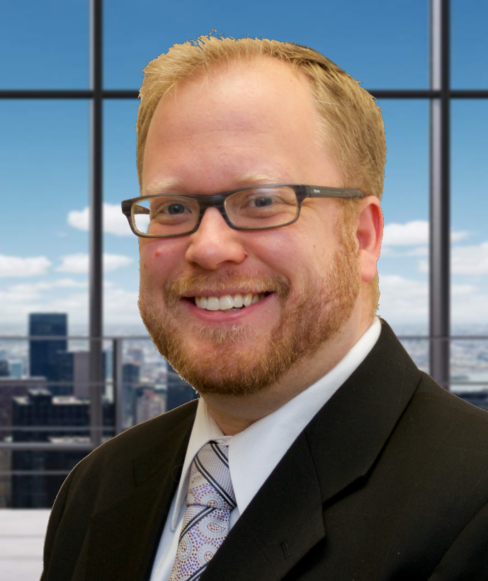 A man in a suit and tie is smiling in front of a window