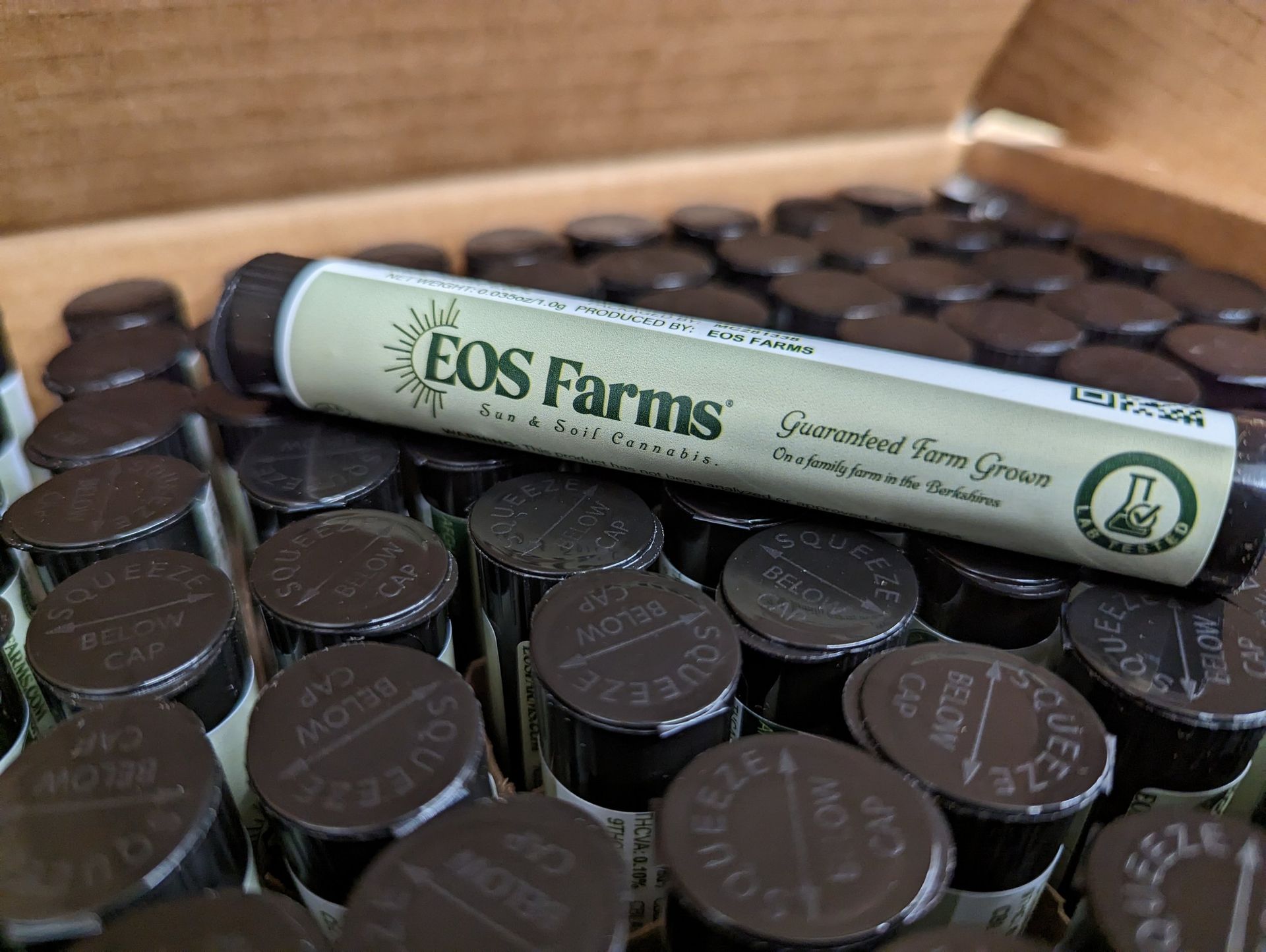 A bunch of eos farms tubes are sitting on top of each other.