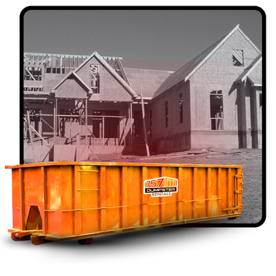 757 dumpster in front of a constructed house