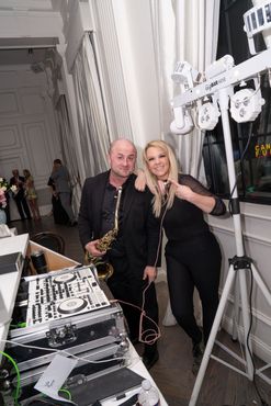 Sax player and DJ at a wedding reception