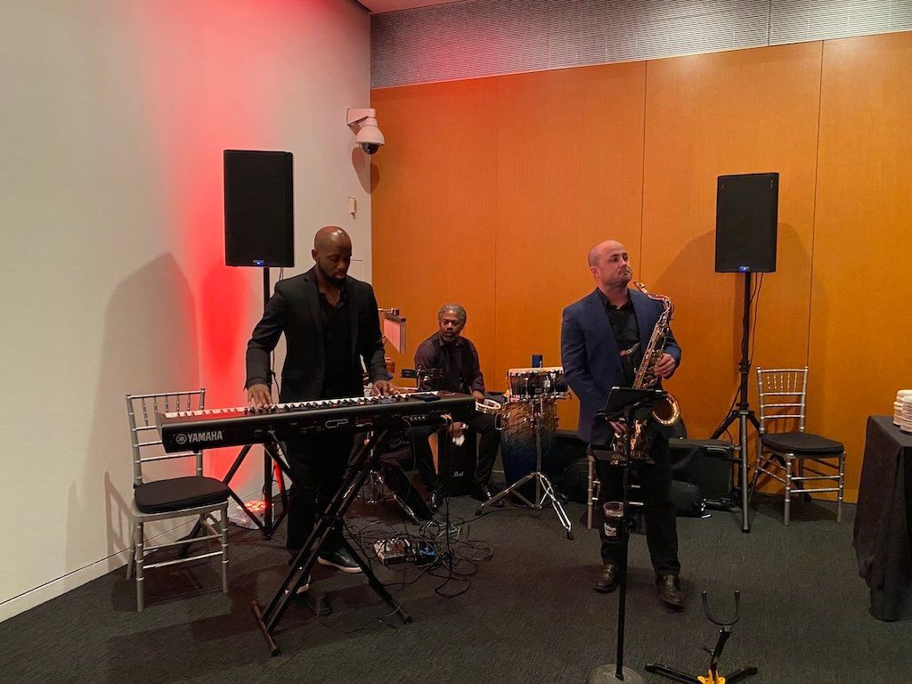 A group of men are playing instruments in a room.