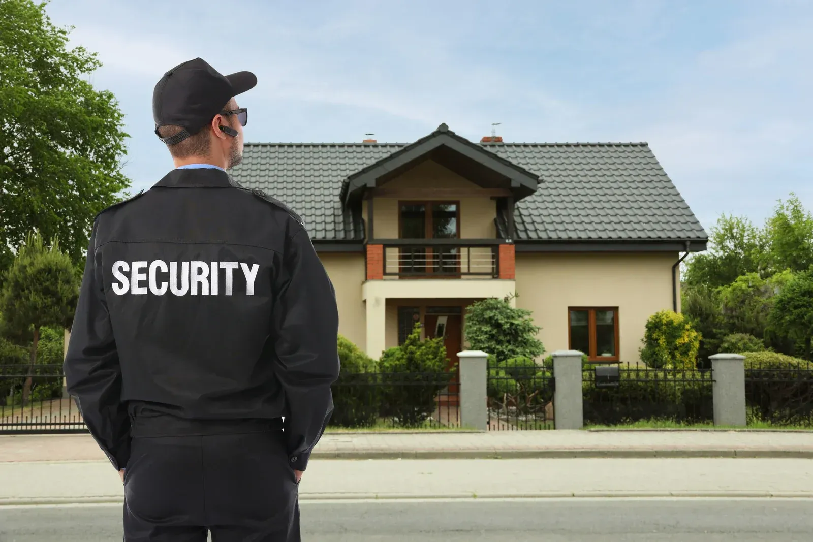 Vehicles parked in snowy outdoor area at night, lit by streetlights. Trees and a dark sky in background.