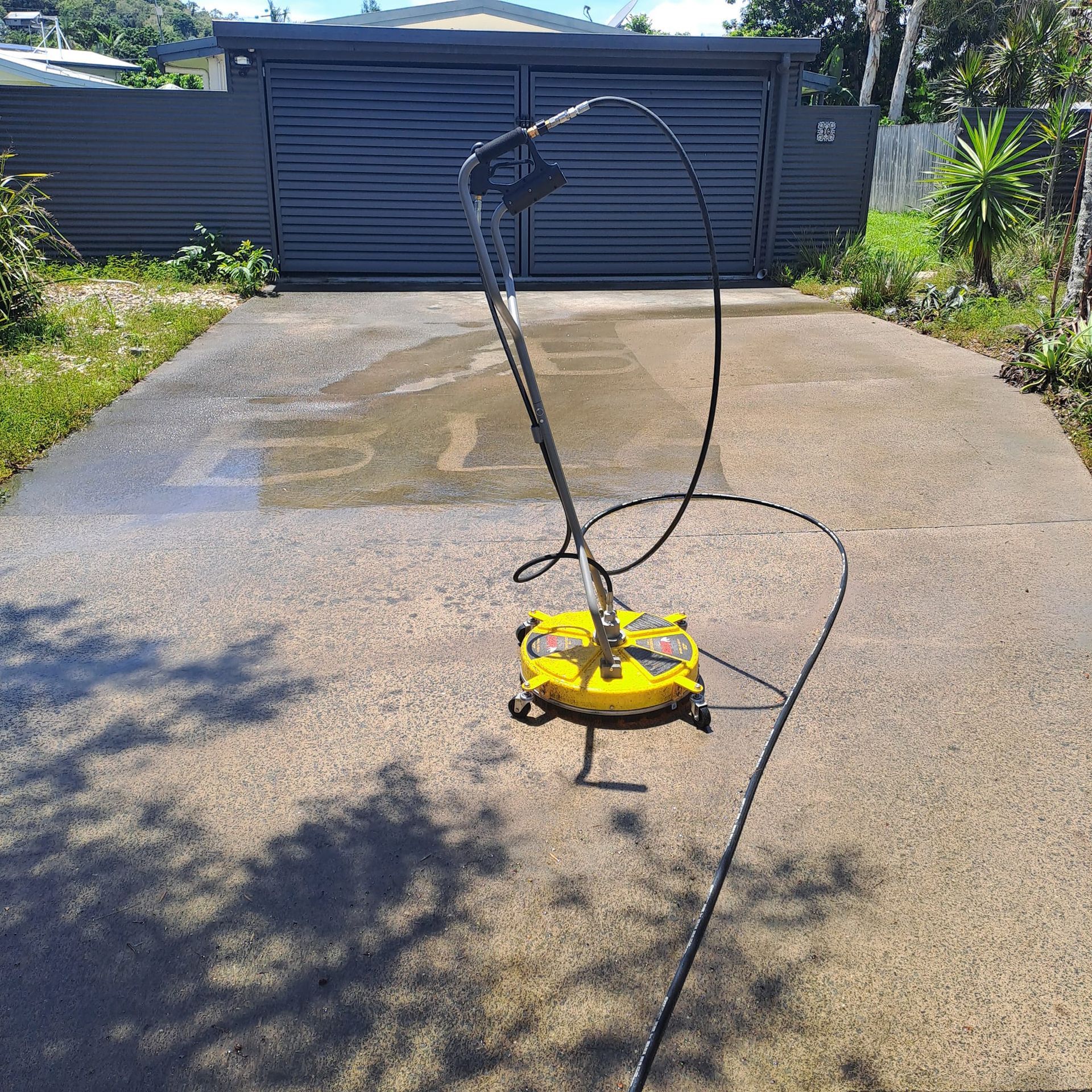 Yellow Surface Cleaner on a Concrete Driveway, Cleaning Surface — Busy Bees Blasting in Trinity Beach, QLD