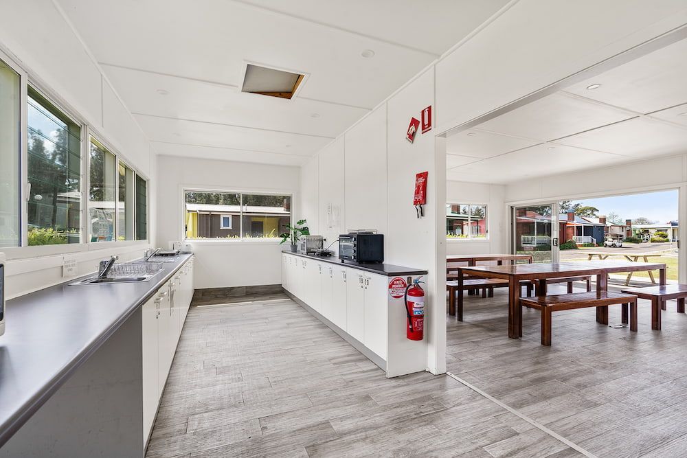 Interior of a Bright Cafeteria-style Room With Long Countertop, Windows — SeaChange Parks Milton in Lake Conjola, NSW