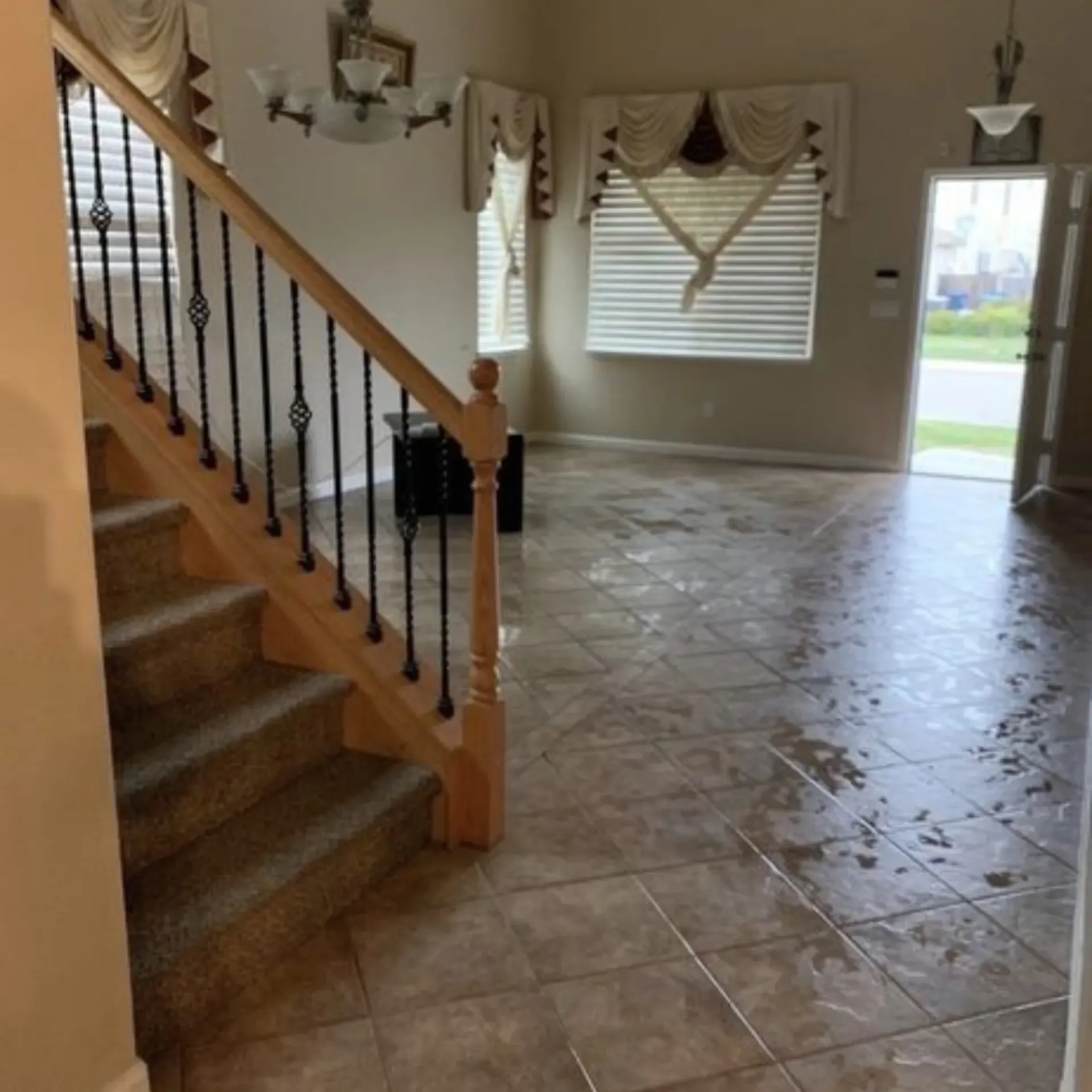 Clean Dry Carpet Care - A living room with a staircase leading up to the second floor
