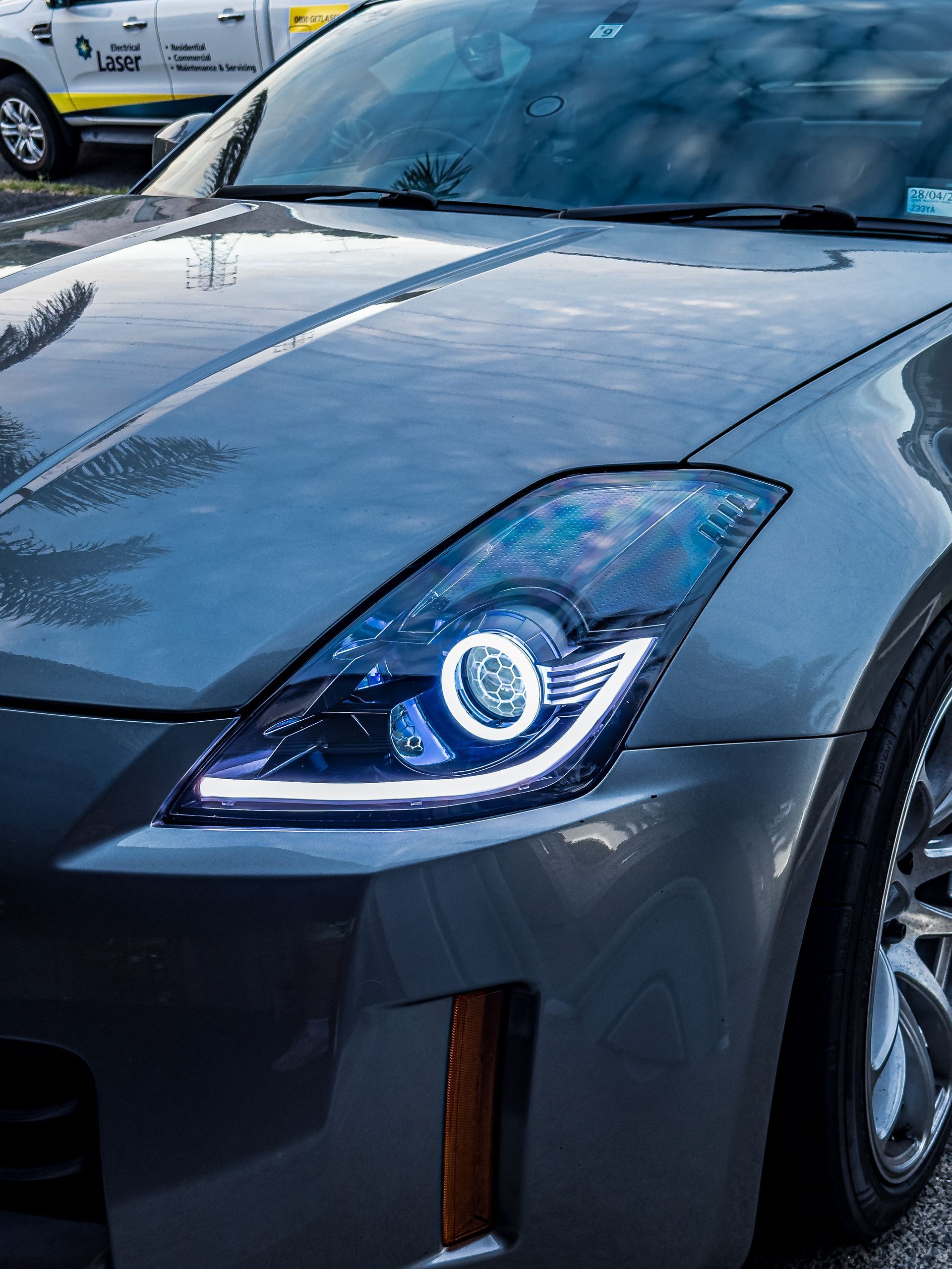 Nissan 350z (facelift) - Gloss Black, RGB Halos, RGB Strip, RGB Demon Eyes, Honeycombed etched lens 