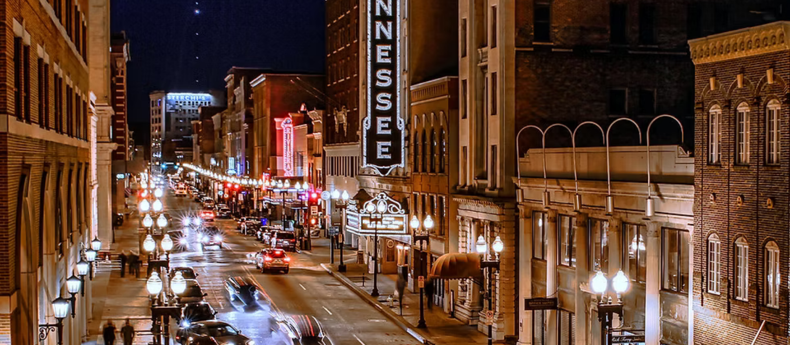 A bridge over a body of water with a dock in the foreground.