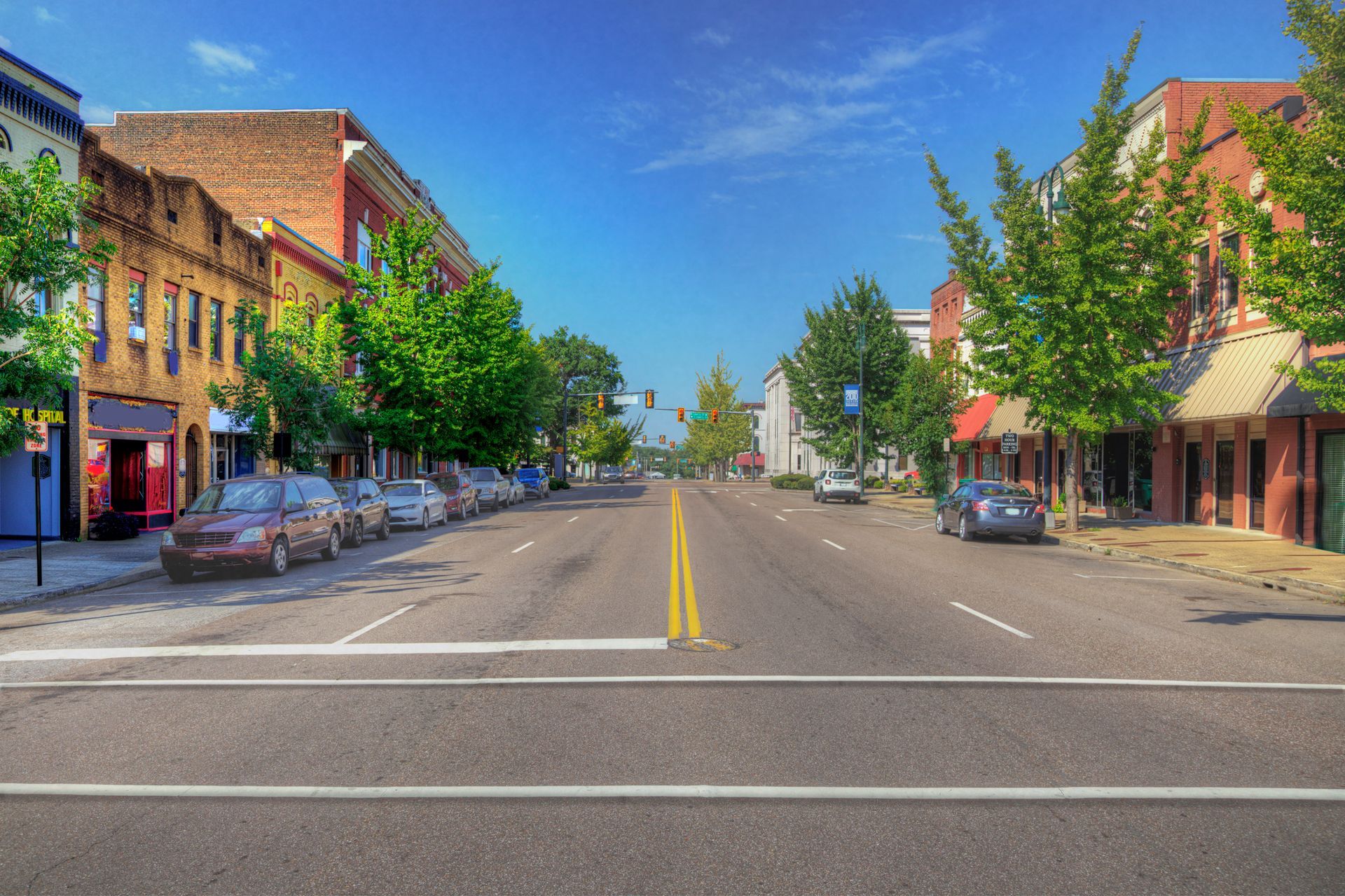 A city street with cars parked on the side of it