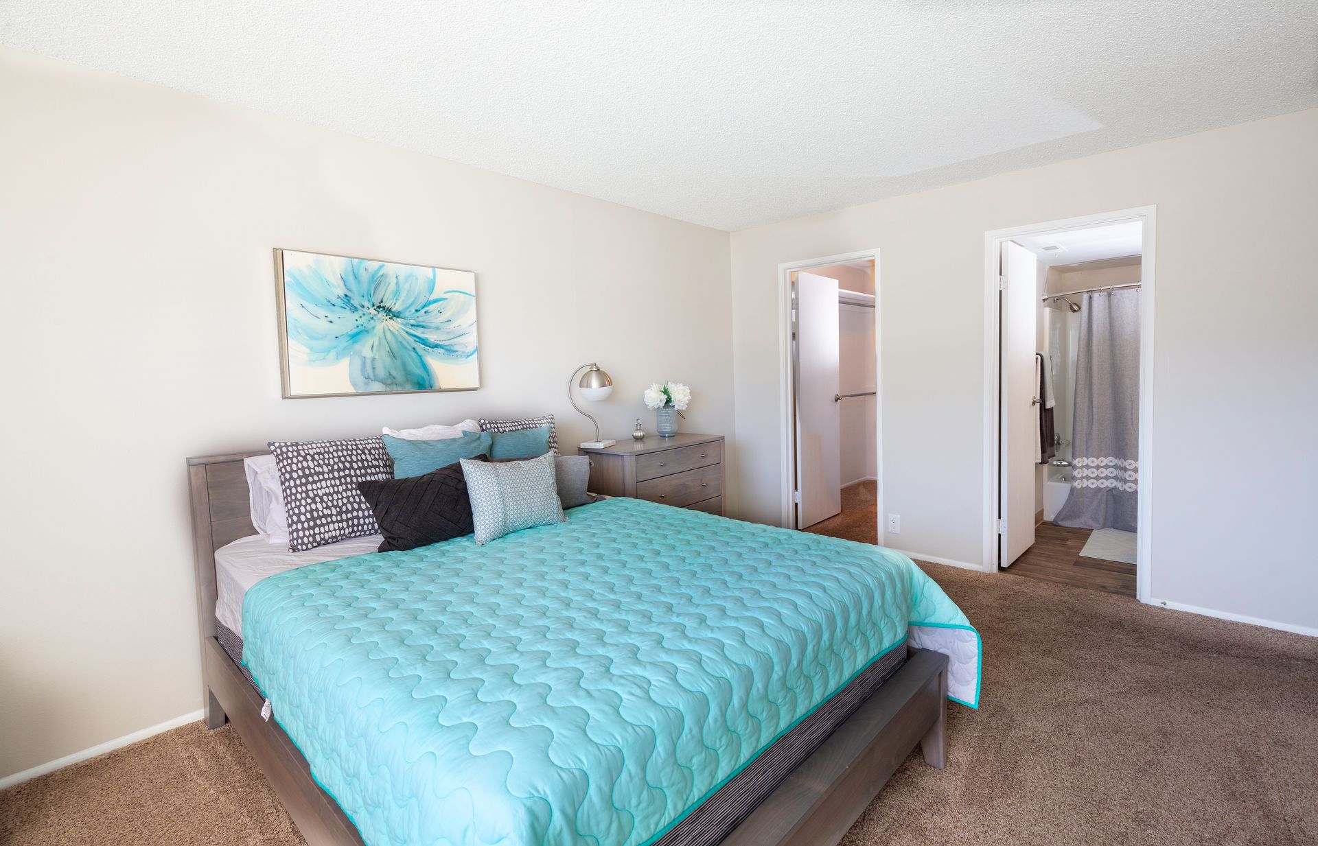 a bedroom with a king size bed and a walk in closet .