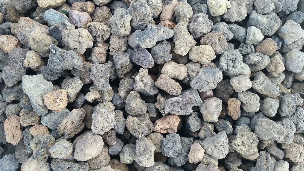 A Pile of Scoria Sitting on Top of Each Other on a Table — Blue River Landscape Supplies in Foulden, QLD