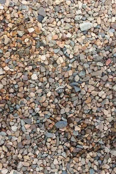 A Pile of River Rock is Sitting on the Ground — Blue River Landscape Supplies in Foulden, QLD