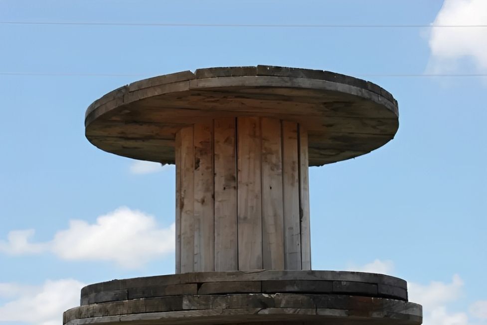 A Wooden Spool With a Blue Sky in the Background — Blue River Landscape Supplies in Foulden, QLD