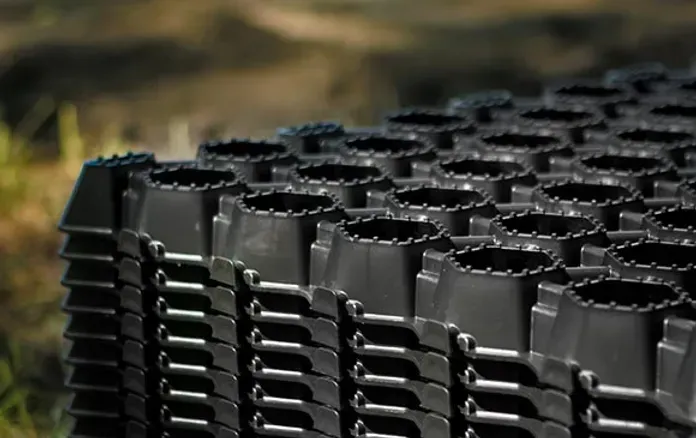 A Stack of Black Plastic Trays Sitting on Top of Each Other — Blue River Landscape Supplies in Foulden, QLD
