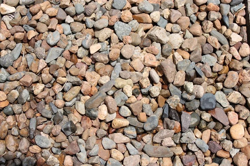 A Pile of River Rock Ten Mm is Sitting on the Ground — Blue River Landscape Supplies in Foulden, QLD