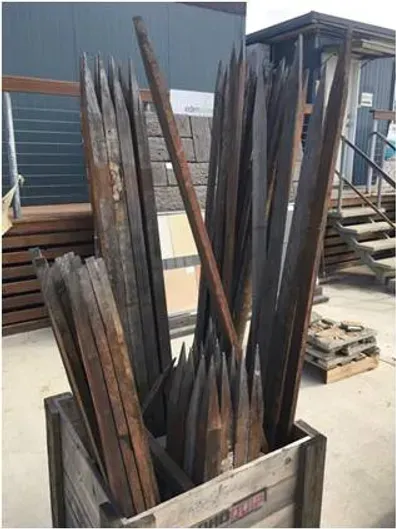A wooden box filled with a bunch of wooden sticks — Blue River Landscape Supplies in Foulden, QLD