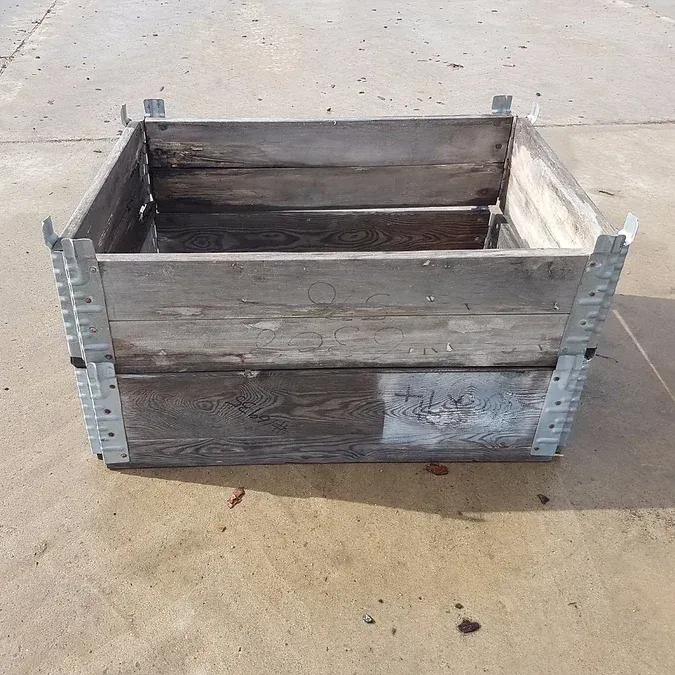 A Wooden Box is Sitting on a Concrete Surface — Blue River Landscape Supplies in Foulden, QLD