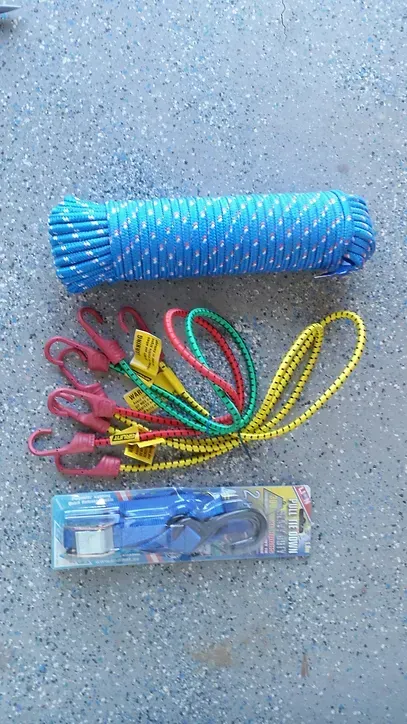 A Bunch of Colorful Ropes and a Pair of Scissors Are Sitting on the Ground — Blue River Landscape Supplies in Foulden, QLD