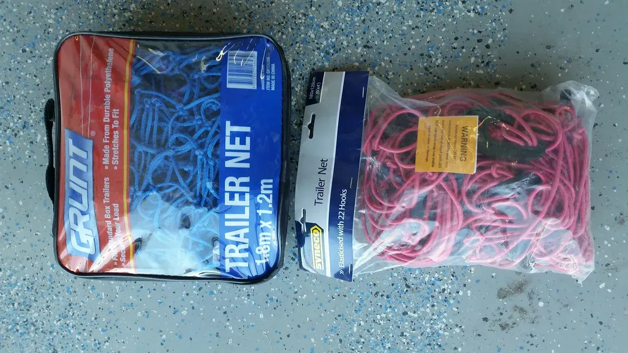A Bag of Trailer Net is Next to a Bag of Rubber Bands — Blue River Landscape Supplies in Foulden, QLD