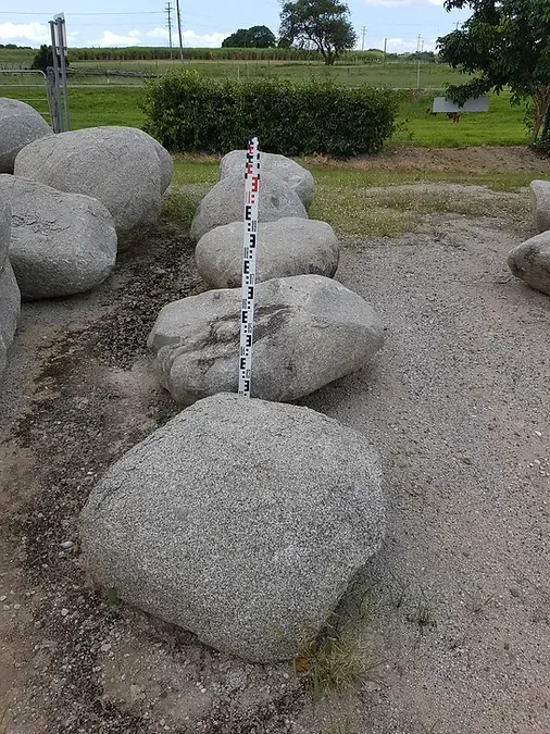 A Pile of Rocks With a Measuring Stick in the Middle — Blue River Landscape Supplies in Foulden, QLD