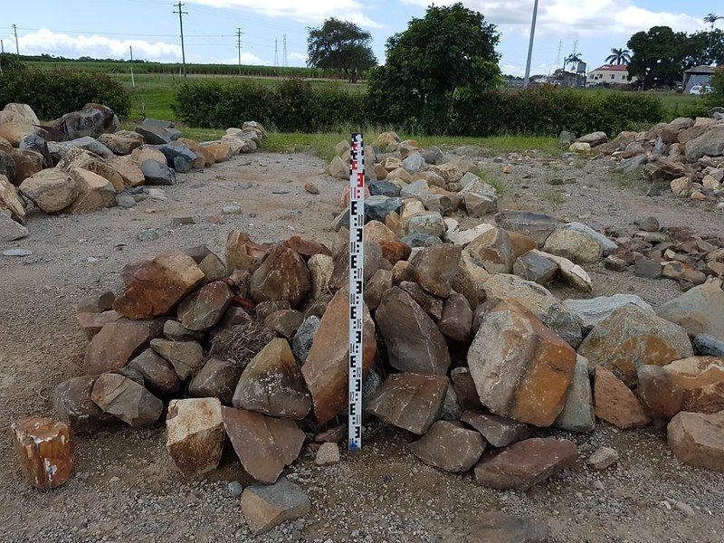 A Pile of Rocks With a Measuring Stick in the Middle — Blue River Landscape Supplies in Foulden, QLD