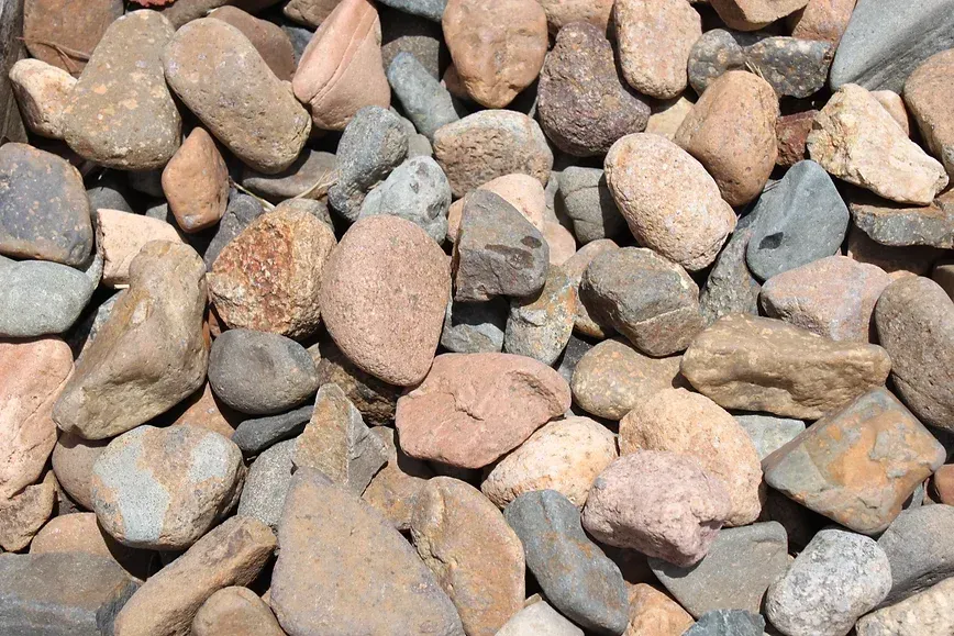 A Pile of Rocks of Different Sizes and Colors — Blue River Landscape Supplies in Foulden, QLD