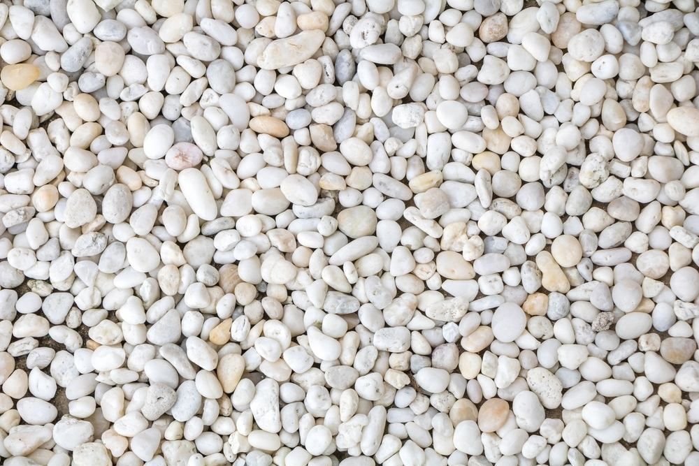 A Pile of White Gravel is Sitting on the Ground — Blue River Landscape Supplies in Foulden, QLD