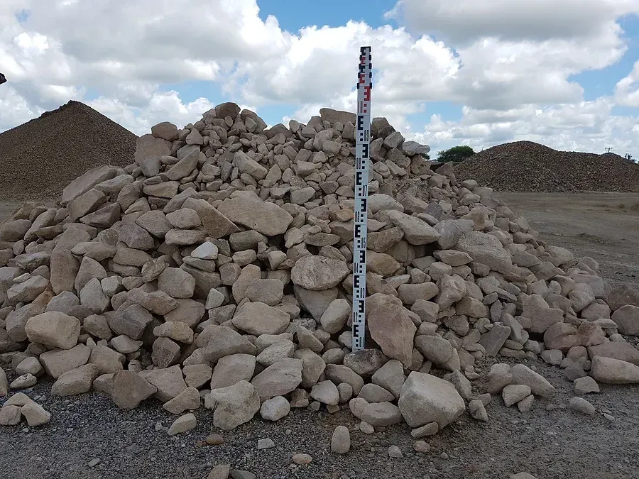A Pile of Rocks With a Measuring Stick in the Middle — Blue River Landscape Supplies in Foulden, QLD