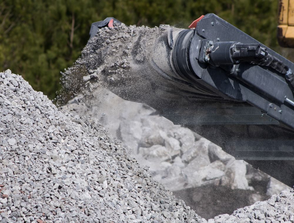 A Pile of Gravel is Being Scooped by a Machine — Blue River Landscape Supplies in Foulden, QLD