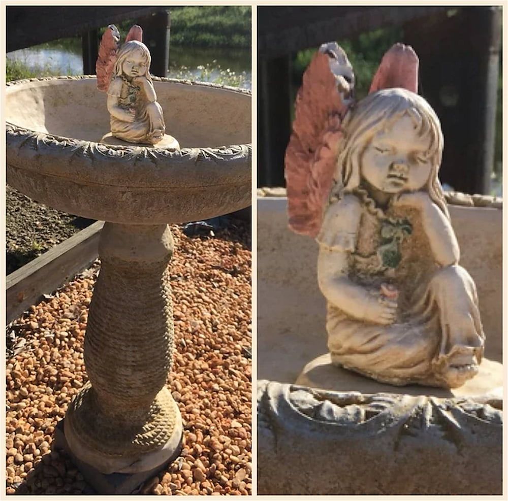 A Statue of a Girl With Wings Sitting Next to a Bird Bath — Blue River Landscape Supplies in Foulden, QLD