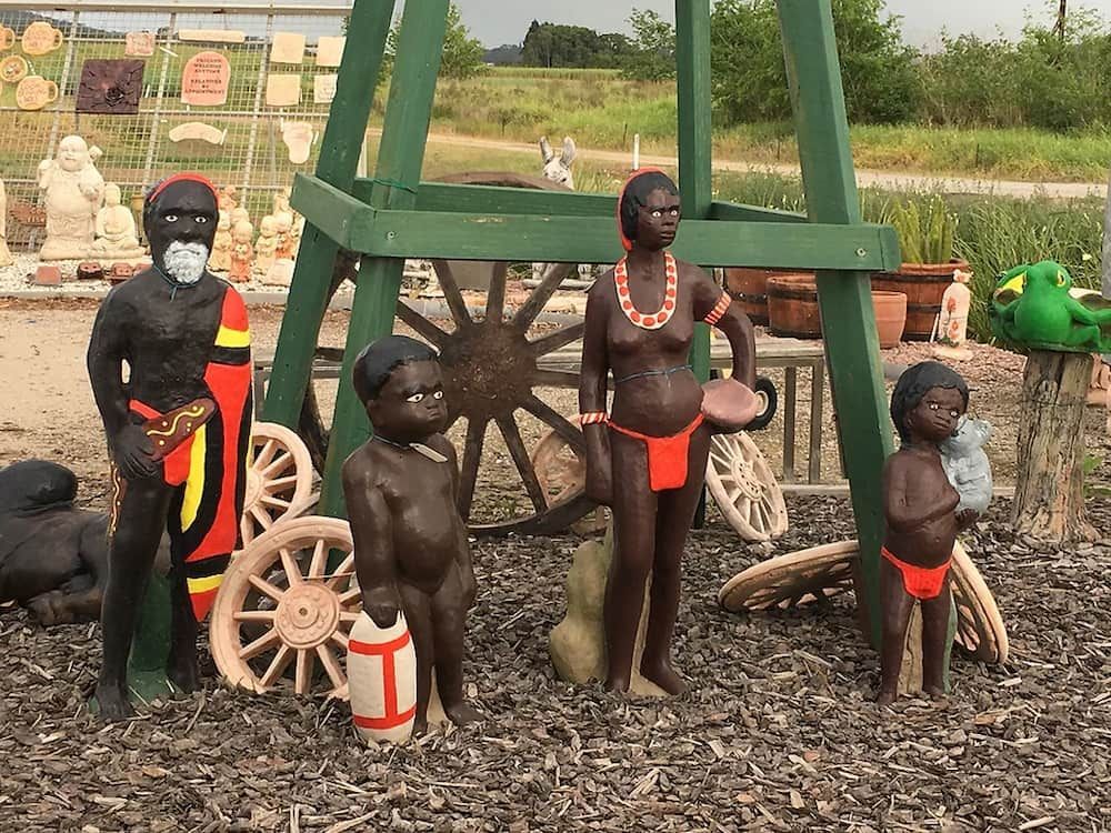 A Group of Statues of African People Standing Next to Each Other — Blue River Landscape Supplies in Foulden, QLD