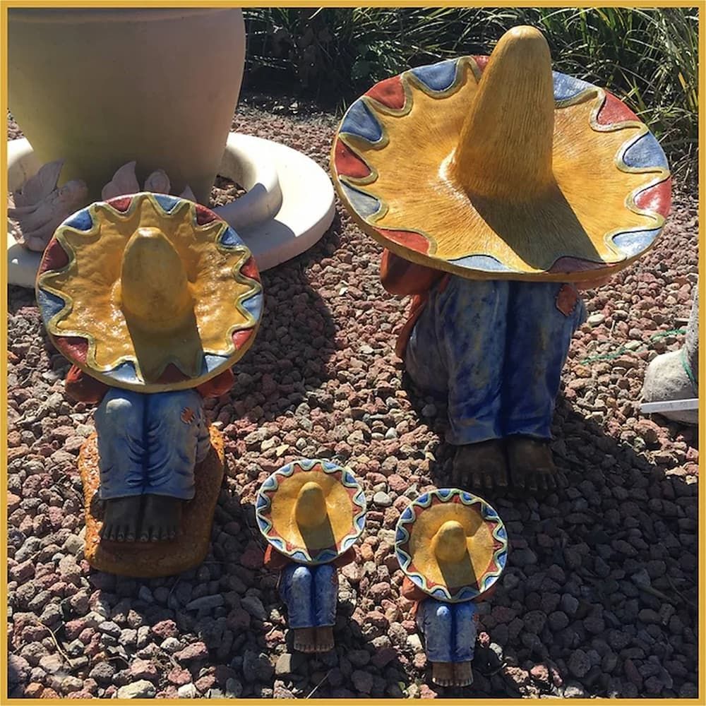 A Group of Statues of People Wearing Sombrero Hats — Blue River Landscape Supplies in Foulden, QLD