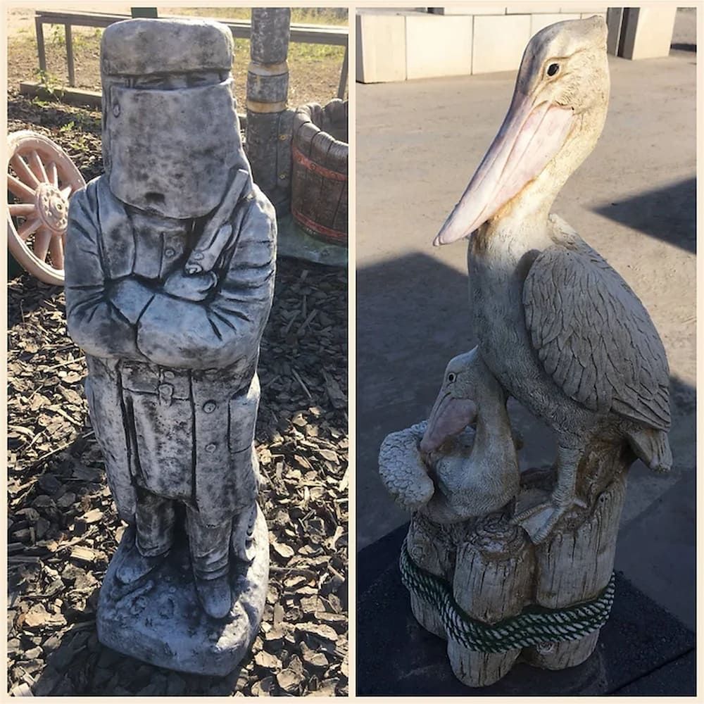 A Statue of a Man and a Pelican Are Next to Each Other — Blue River Landscape Supplies in Foulden, QLD