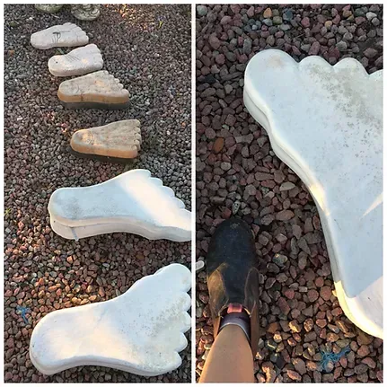 A Person is Standing Next to a Giant Foot Shaped Stepping Stone — Blue River Landscape Supplies in Foulden, QLD