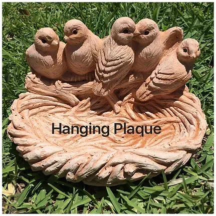 A Hanging Plaque With Birds in a Nest is Sitting on Top of a Lush Green Field — Blue River Landscape Supplies in Foulden, QLD