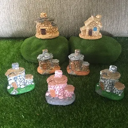 A Group of Miniature Houses Are Sitting on Top of Rocks — Blue River Landscape Supplies in Foulden, QLD