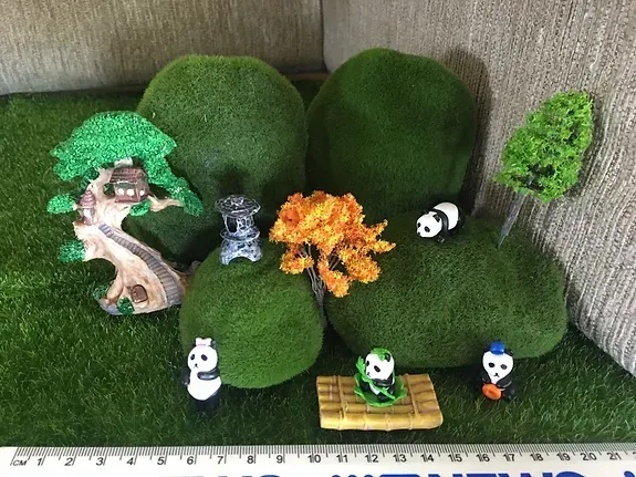 A Ruler is Sitting on a Table Next to a Bunch of Toys — Blue River Landscape Supplies in Foulden, QLD