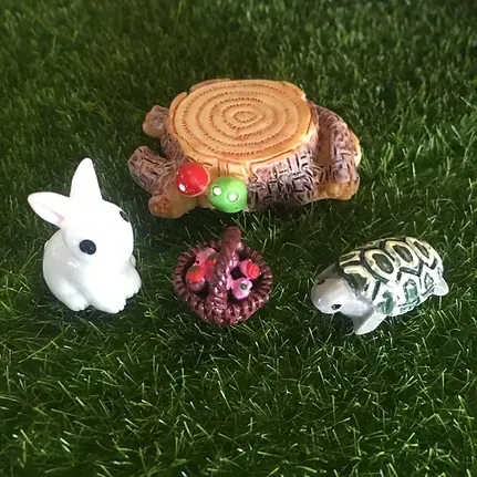 A Rabbit , a Turtle , and a Stump Are Sitting on the Grass — Blue River Landscape Supplies in Foulden, QLD