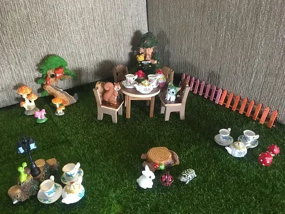 A Toy Tea Set is Sitting on Top of a Lush Green Lawn — Blue River Landscape Supplies in Foulden, QLD