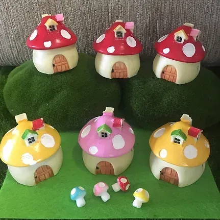A Group of Mushroom Houses Are Sitting on Top of a Green Table — Blue River Landscape Supplies in Foulden, QLD