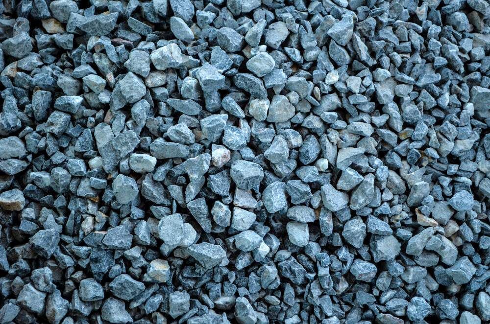 A Pile of Blue Gravel is Sitting on the Ground — Blue River Landscape Supplies in Foulden, QLD