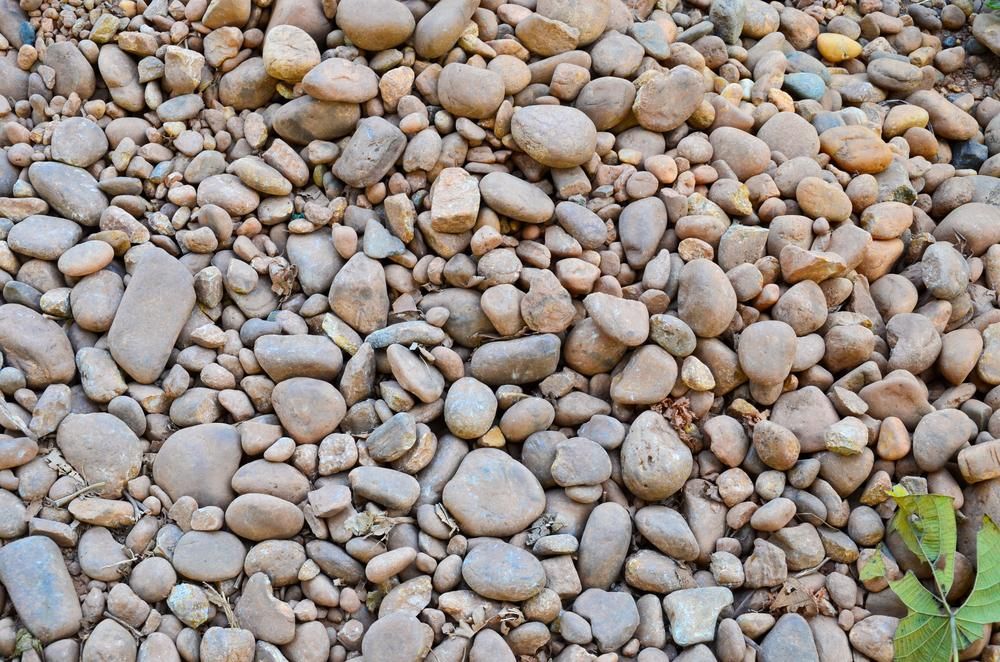 A Pile of Rocks Sitting on Top of Each Other on the Ground — Blue River Landscape Supplies in Foulden, QLD