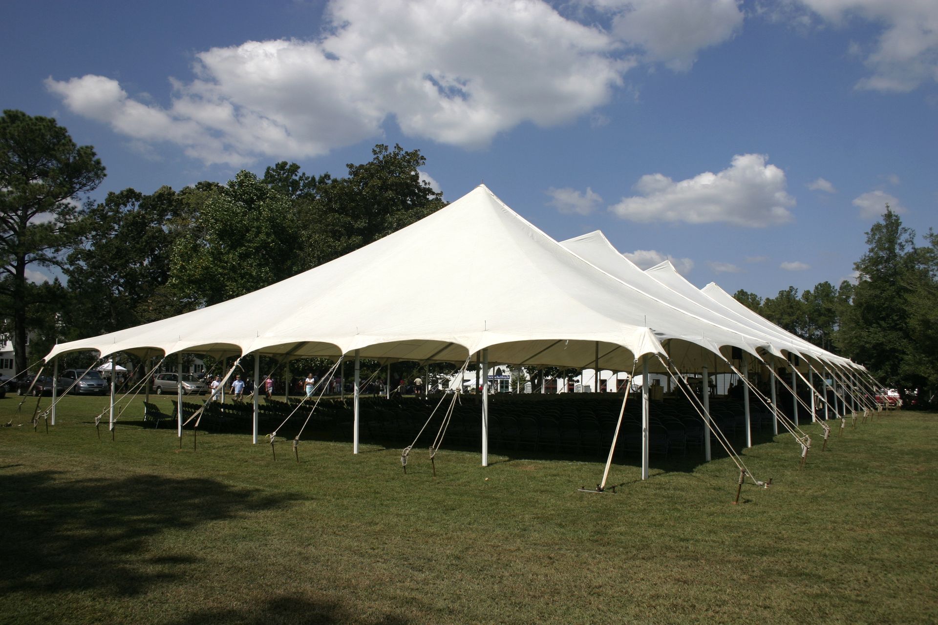 A large tent set up on the lawns for a banquet.