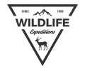 A black and white logo for wildlife expeditions with a deer in a triangle.