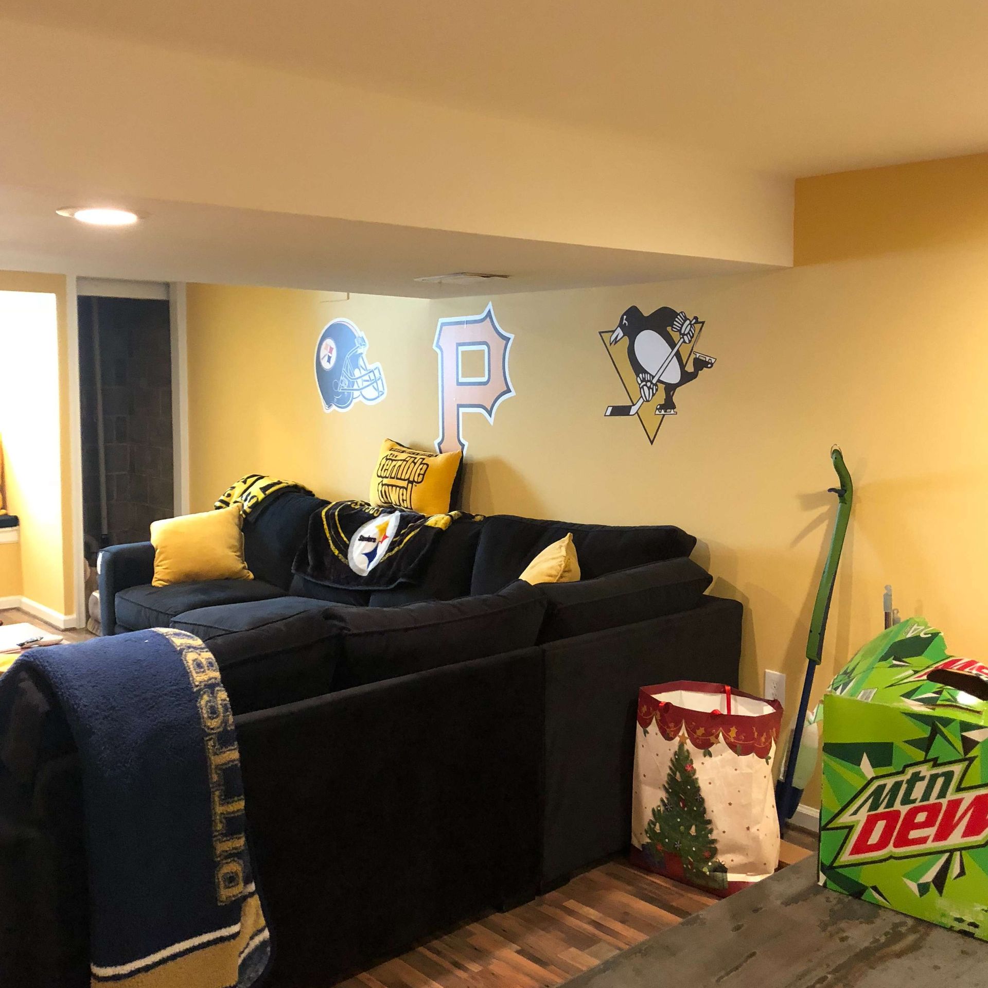 A living room with a couch and a bag of mountain dew