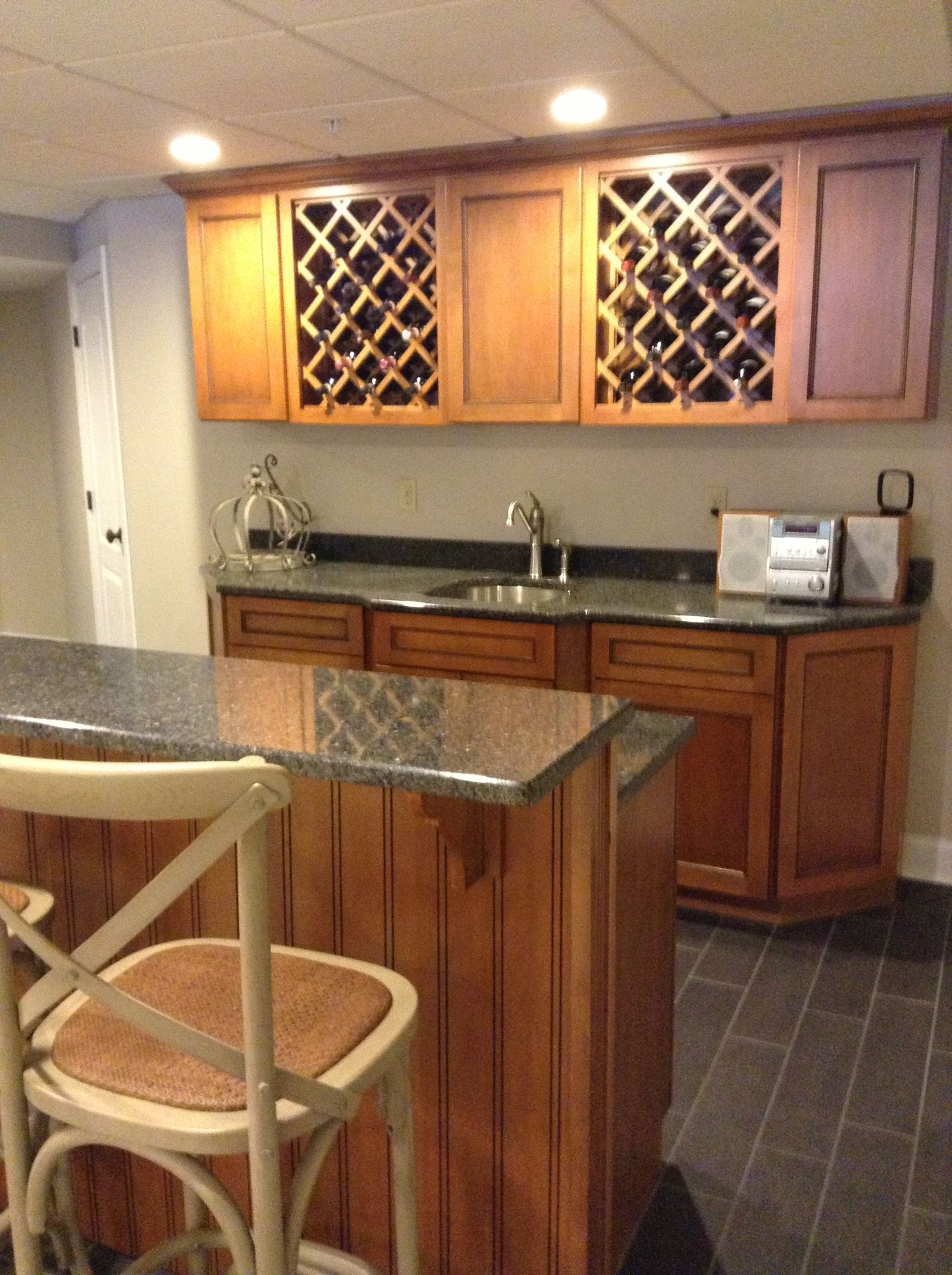 A kitchen with wooden cabinets and granite counter tops