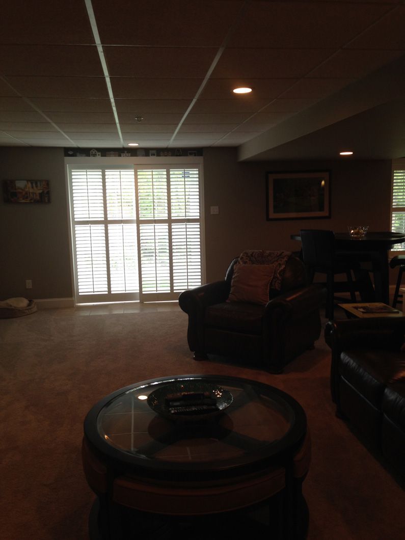 A living room with a round coffee table and chairs
