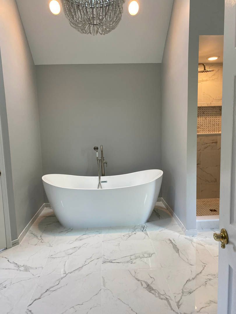 There is a bathtub in the middle of the bathroom.