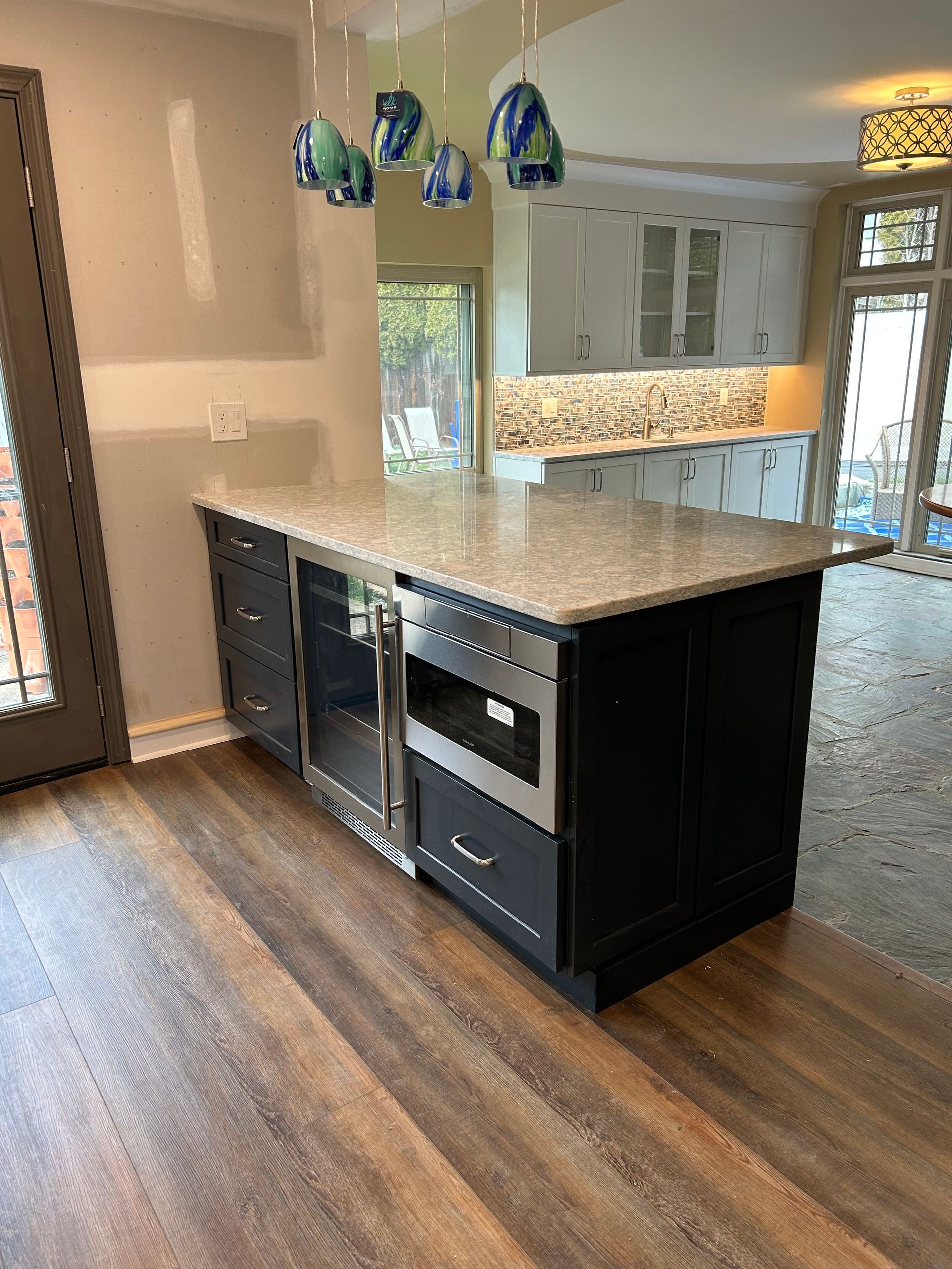 There is a large island in the middle of the kitchen.